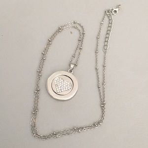 Silver-tone necklace with double sided charm